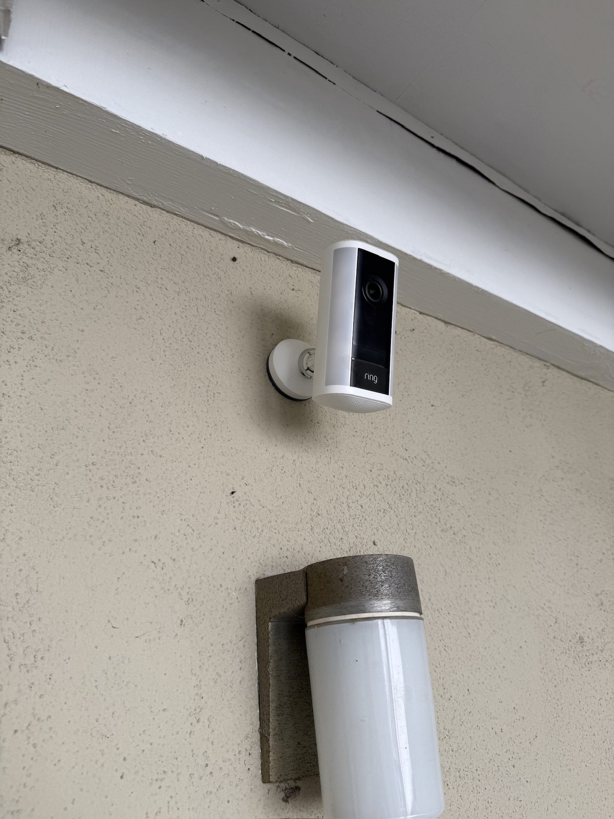 Front-entry camera covering the porch, door, and walkway of a home.