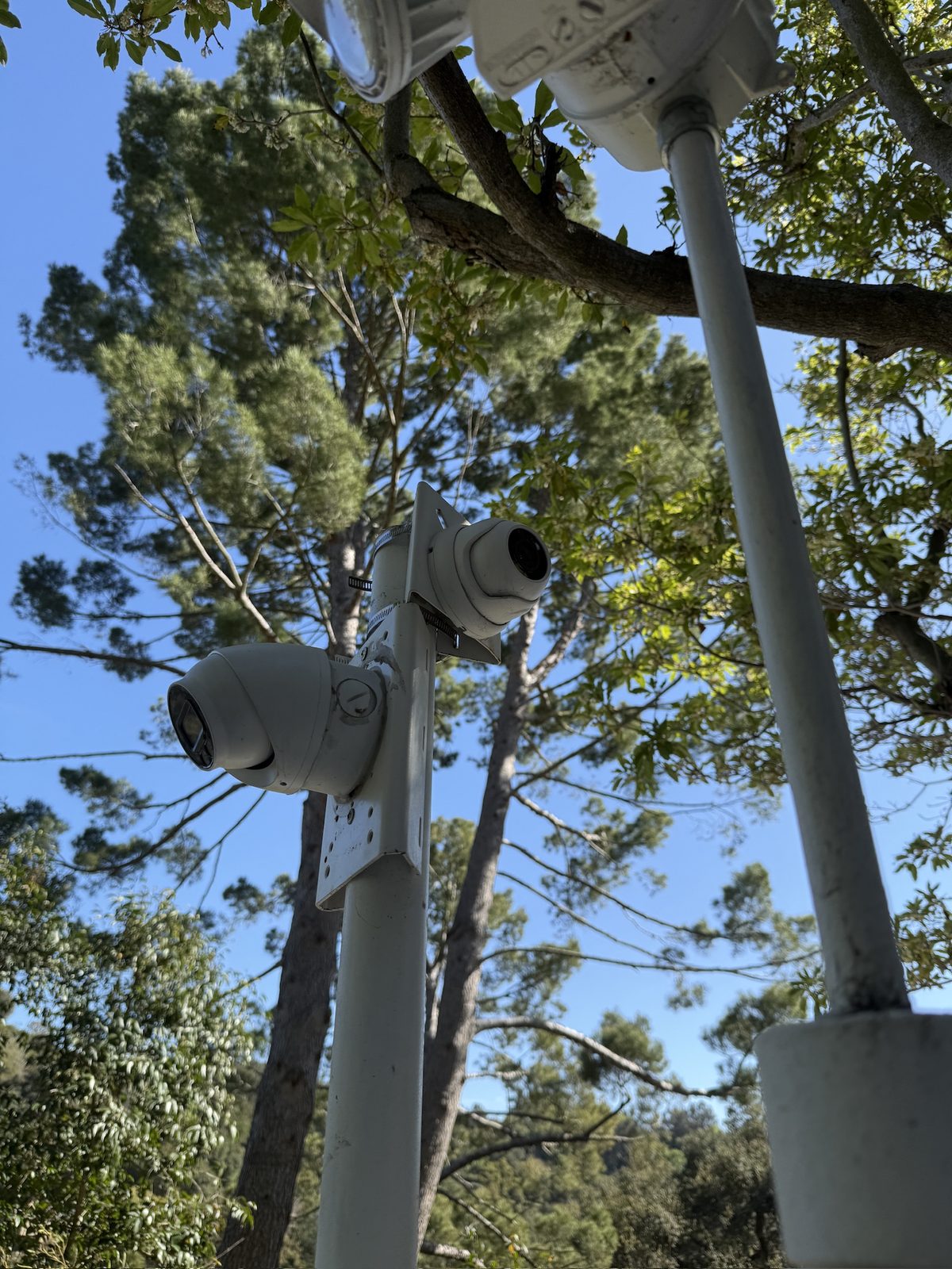 Multiple outdoor cameras covering the grounds of a larger property.